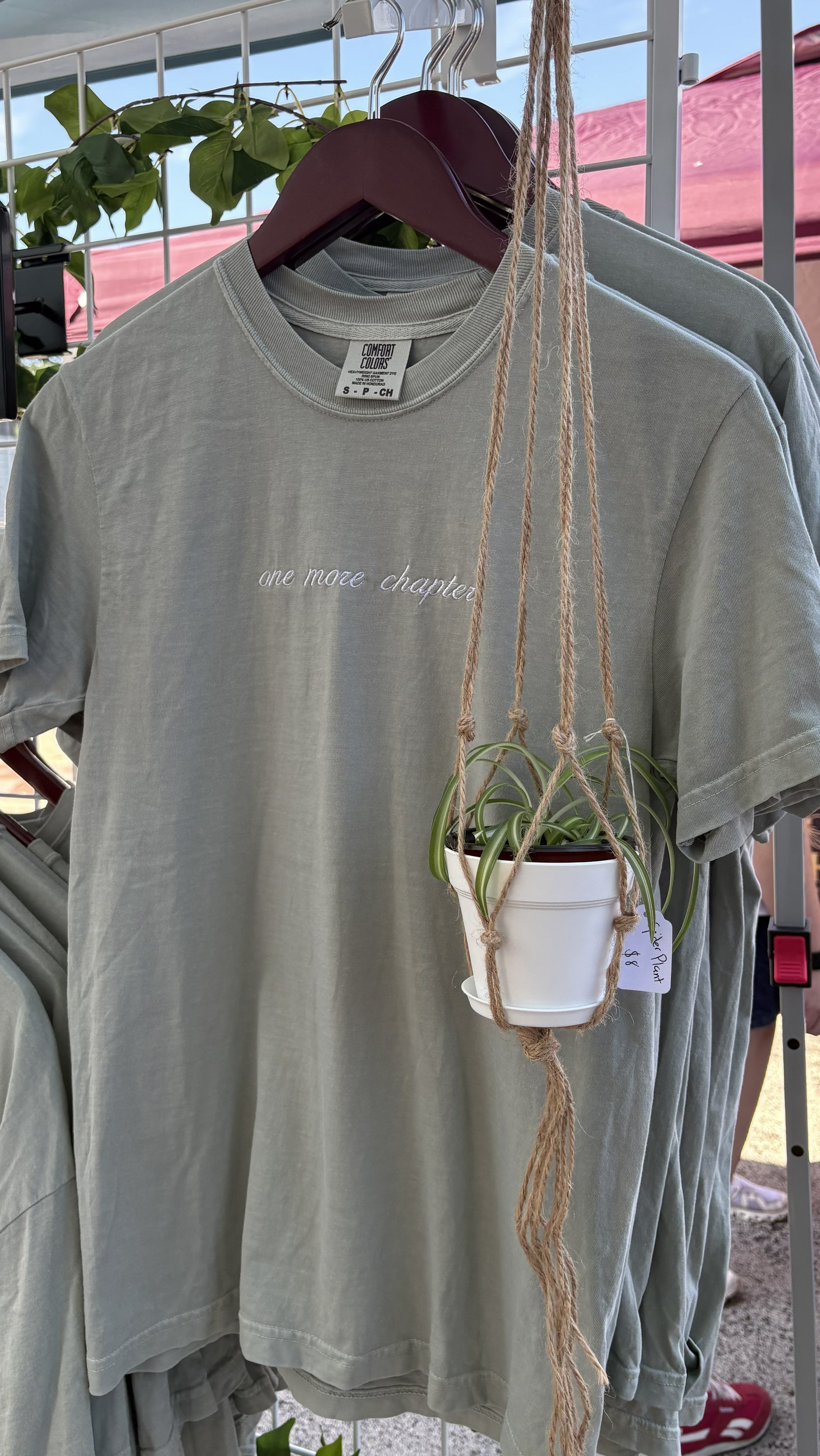 A Bay Green colored t-shirt with 'one more chapter' in soft writing